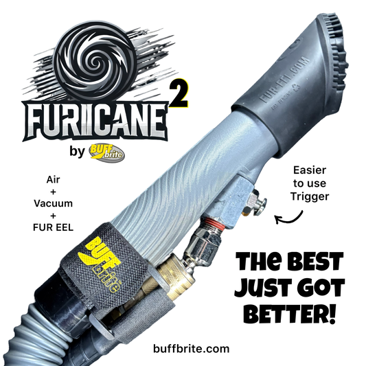 A close-up product shot of a FURICANE 2 vacuum wand attachment by Buff Brite, showing the gray flexible wand body, black nozzle head, trigger switch, and branded strap on a white background with promotional text.